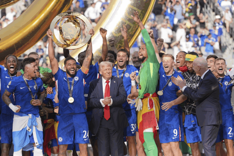 Chelsea's Reece James (24) lifts the trophy as President Donald Trump looks on following the Club World Cup final soccer match between Chelsea and PSG in East Rutherford, N.J. on Sunday.