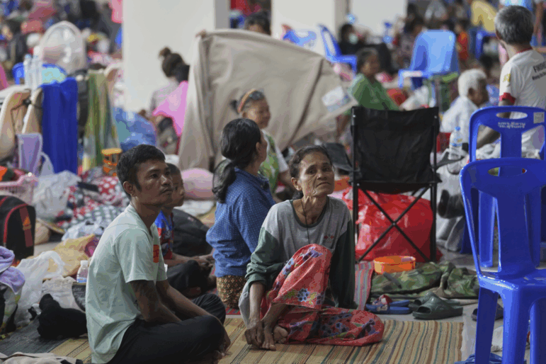 Thai residents who fled homes following clashes between Thai and Cambodian soldiers rest at an evacuation center in Surin province, Thailand, Sunday, July 27, 2025.