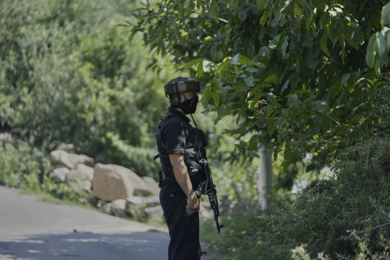 Jammu and Kashmir Special Operation Group personnel guard near the site of a gun battle on the outskirts of Srinagar, Indian controlled Kashmir, Monday, July 28, 2025.