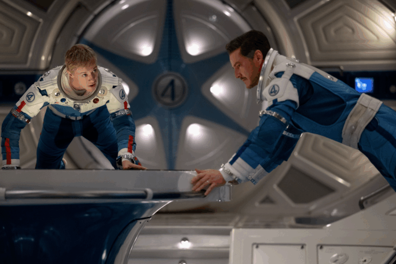 Joseph Quinn as Johnny Storm/Human Torch and Pedro Pascal as Reed Richards/Mister Fantastic in The Fantastic Four: First Steps.