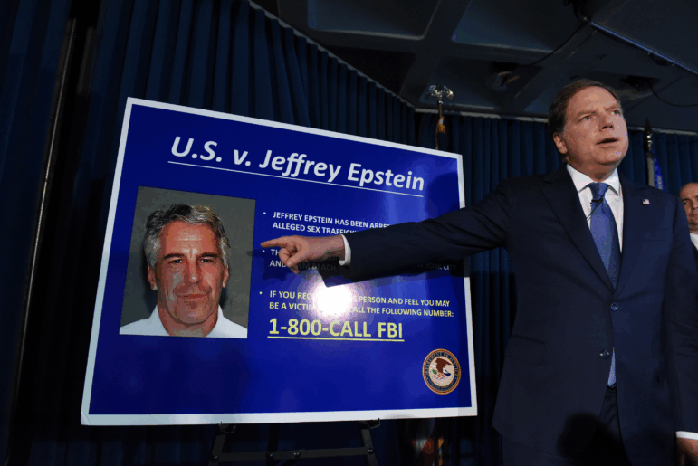 U.S. Attorney for the Southern District of New York Geoffrey Berman points to a photo of sex offender Jeffery Epstein on July 8, 2019, as he announces that Epstein was charged with sex trafficking minors and conspiracy.