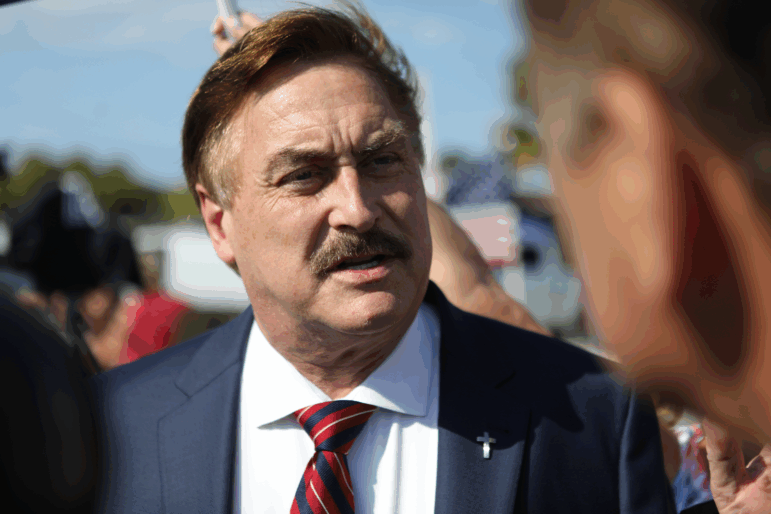 MyPillow CEO Mike Lindell arrives at a gathering of supporters of Donald Trump near Trump's residence in Palm Beach, Fla., on April 4, 2023.