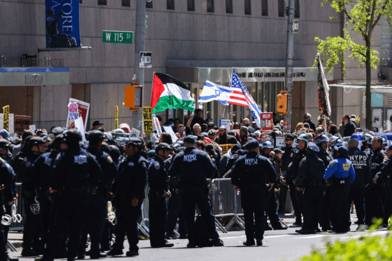 Pro-Palestinian and pro-Israel protesters face off outside of Columbia University on April 22, 2024.