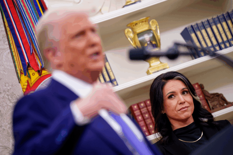 President Trump, accompanied by Tulsi Gabbard, speaks after Gabbard is sworn in as director of national intelligence on February 12.