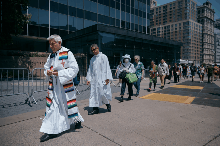 Activists hold a "Jericho Walk" in support of immigrants in front of Jacob K. Javits Federal Building in June 2025 in New York City.