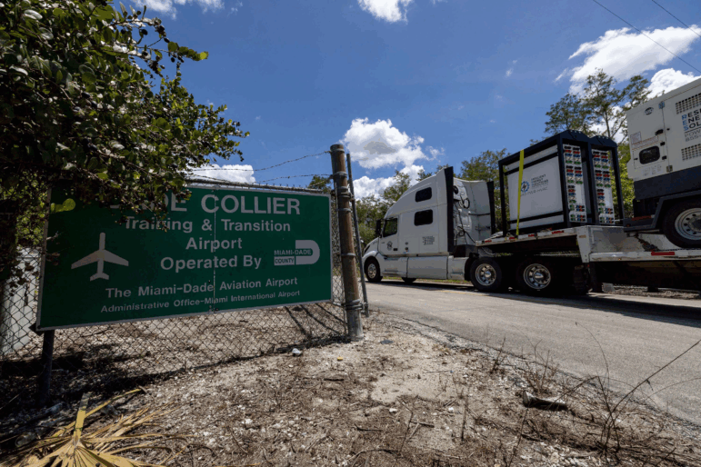 Heavy-duty generators are driven into Dade-Collier Training and Transition Airport last week.