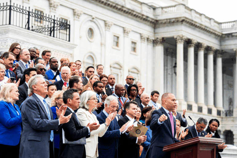 House Minority Leader Hakeem Jeffries, D-N.Y., along with the House Democratic Caucus, assemble on the Capitol steps to rail against President Trump's signature bill of tax breaks and spending cuts on July 2.