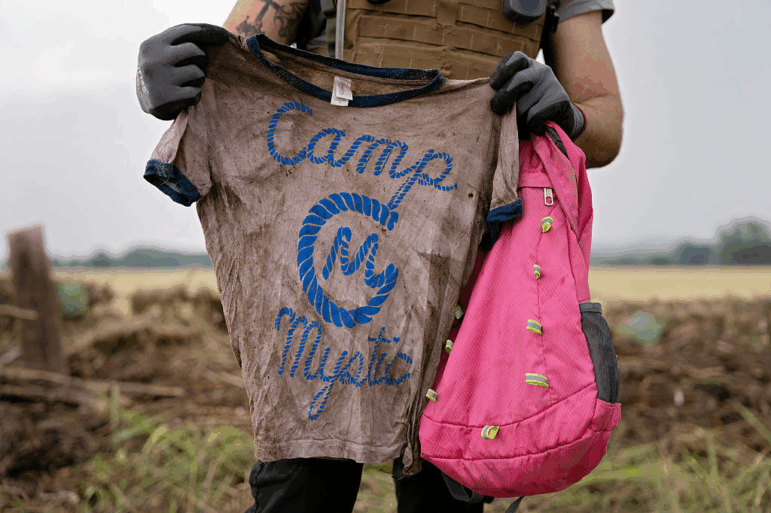 A kid's shirt reading Camp Mystic