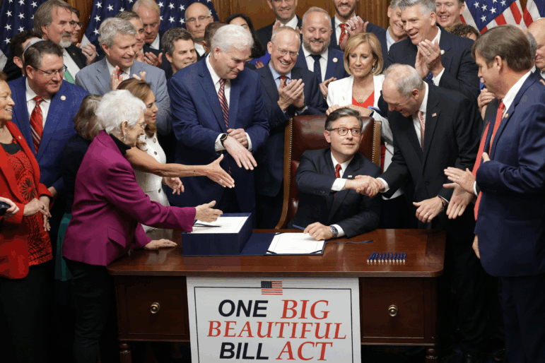 House Speaker Mike Johnson, R-La., celebrates with fellow House Republicans during an enrollment ceremony following final passage on Thursday.