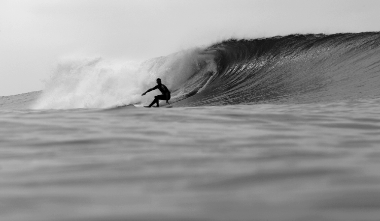 Andy Irons of Hawaii takes a bottom turn on a wave during the Boost Mobile Pro, Part of the Foster's ASP Men's World Surfing Tour on September 18, 2005 at Lower Trestles in San Clemente, California. (Photo by Donald Miralle/Getty Images)