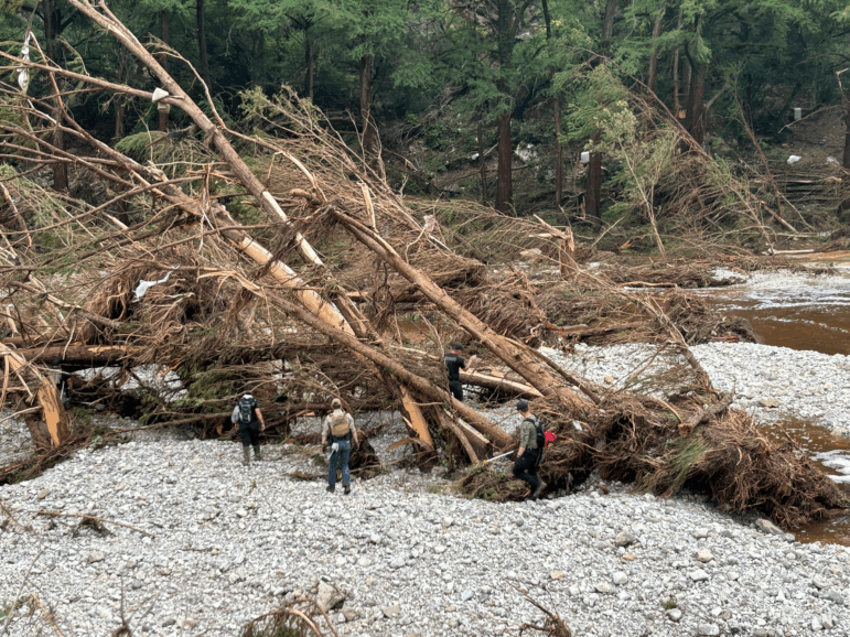 First responders search for missing people near Camp Mystic, an all girls summer camp along the Guadalupe River in Kerrville, Texas, on July 5, 2025.