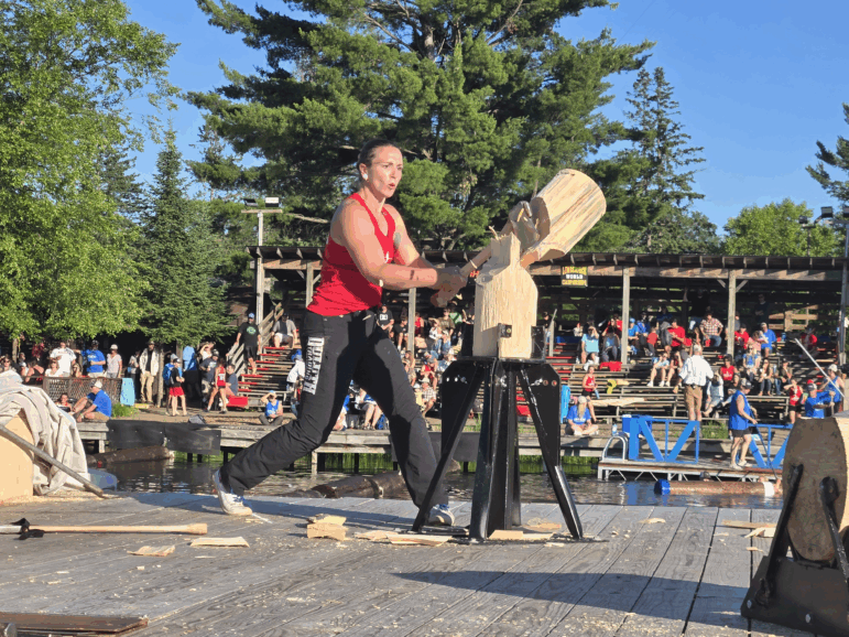 Samantha Graves, of Victor, N.Y., competes in the standing block chop at the 2025 Lumberjack World Championships in Hayward, Wisconsin.