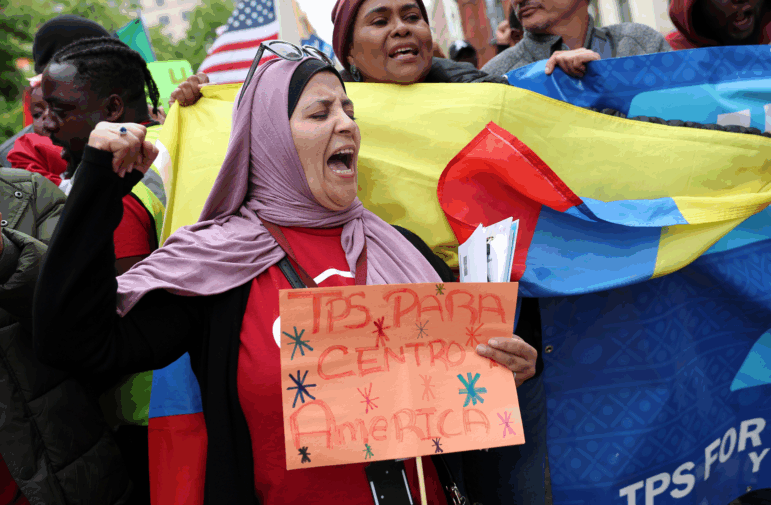 An activist marches during a 2023 rally in Washington, D.C. for temporary protected status for Central American migrants to allow them to stay in the United States.