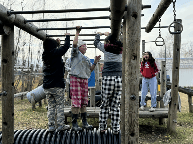 Kids play on old playground equipment during recess in Sleetmute, Alaska. The Legislature has largely ignored rural school districts' repair requests.