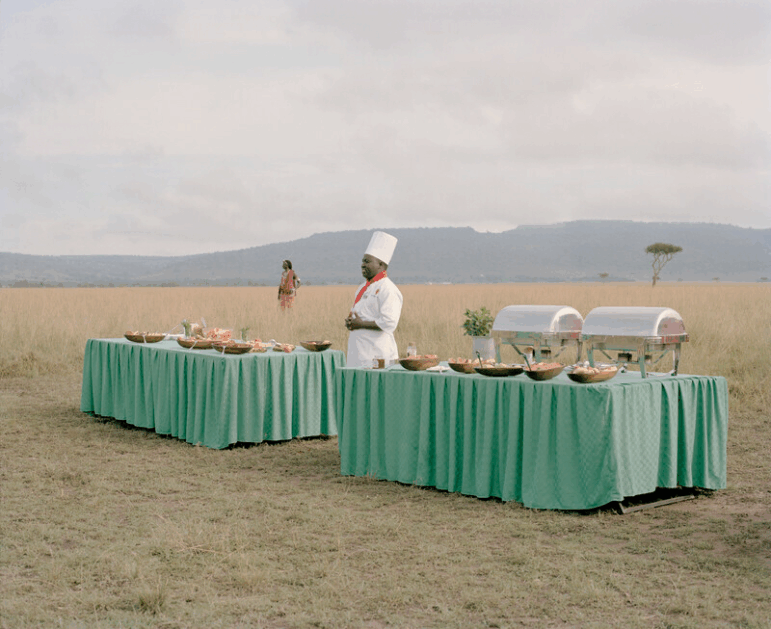 Masai Mara champagne breakfast and hot air balloon Africa Experience. Kenya The African safari industry in Kenya, built on the promise of unspoiled wilderness and abundant wildlife, presents a carefully curated version of nature — one that is often far removed from reality. Tourists drawn by colonial legacies, glossy brochures and documentaries arrive expecting vast landscapes teeming with animals, untouched by human influence. What they experience is a highly managed and commercialised spectacle. The idea of a vast, untouched “African wilderness” is largely a fiction that ignores the rapid decline of wild animal populations due to habitat loss.
