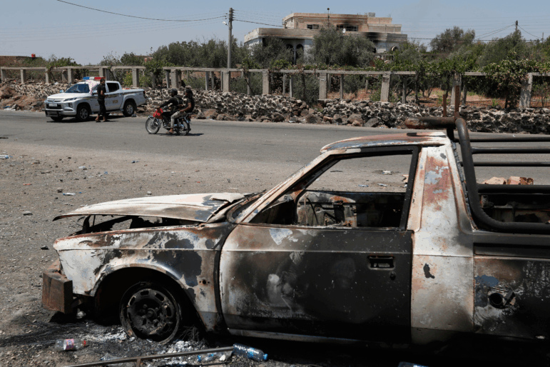 A Syrian security checkpoint is seen as forces deploy in Mazraa village on the outskirts of Sweida city, in southern Syria.