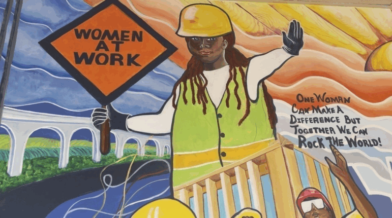 A mural by artist Tene Smith is seen near the entrance of Chicago Women in Trades, a nonprofit dedicated to training and retaining women in the skilled construction trades is photographed April 1, 2025, at the facility in Chicago. (AP Photo/Claire Savage, File)