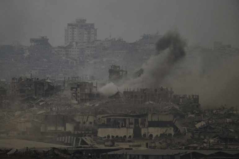 Smoke rises amid destroyed buildings following an Israeli shelling in the Gaza Strip, as seen from southern Israel, Friday, Aug. 1, 2025.