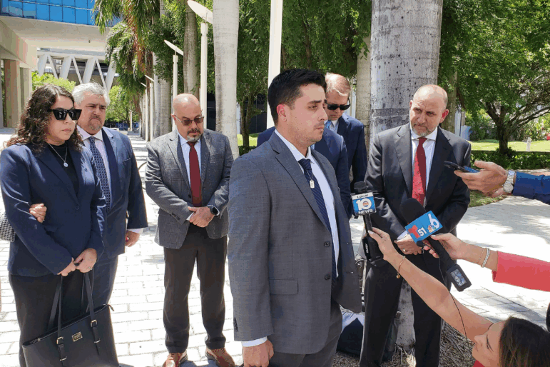 Dillon Angulo, who was seriously injured in a Florida crash involving Tesla’s Autopilot driver assist technology, speaks to reporters outside the federal courthouse in Miami on Friday.