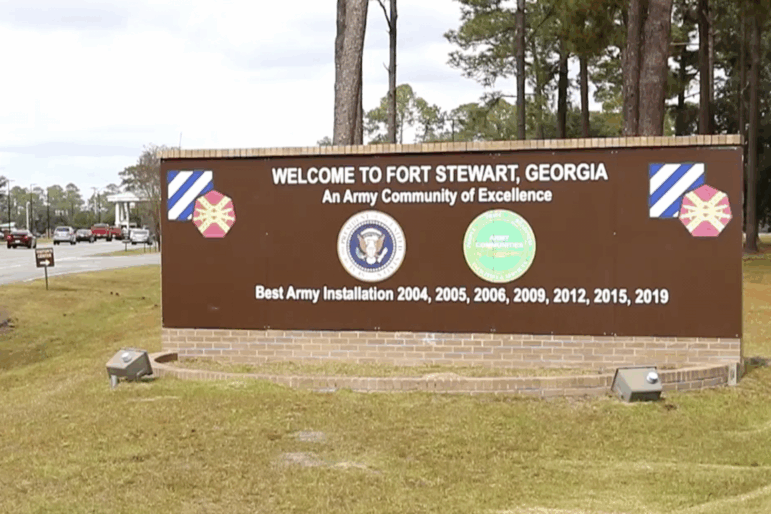 The entrance to Fort Stewart in Georgia on November 18, 2021. A large sign at the entrance says: "Welcome to Fort Stewart, Georgia."