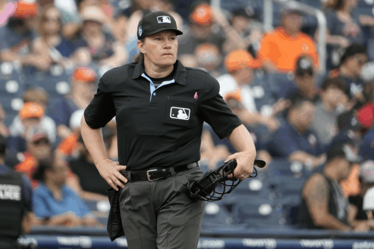 Home plate umpire Jen Pawol takes her position during the first inning of a spring training baseball game between the Houston Astros and Miami Marlins Sunday, March 10, 2024, in West Palm Beach, Fla.