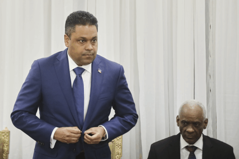 Laurent Saint-Cyr (left) attends the ceremony for his appointment as president of the Transitional Council in Port-au-Prince, Haiti, Thursday.