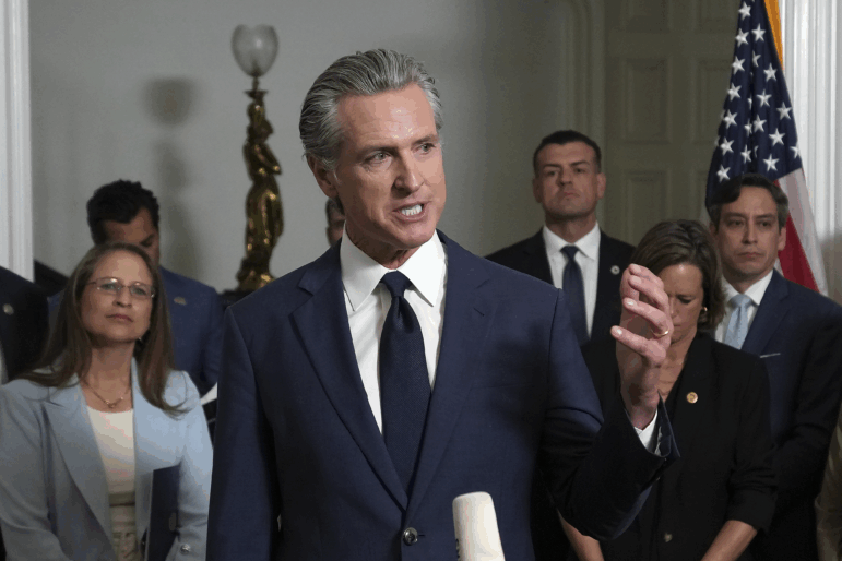 Accompanied by California and Texas lawmakers, California Gov. Gavin Newsom speaks in support of the Texas Democratic lawmakers for their walkout to block a vote on a congressional redistricting plan sought by President Donald Trump, during a news conference in Sacramento, Calif., Friday Aug. 8, 2025.