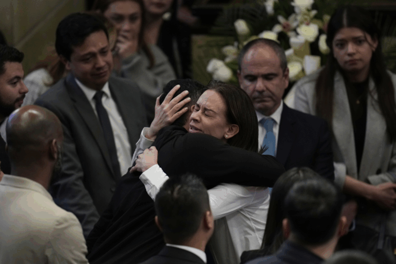 Claudia Tarazona, the wife of opposition Sen. and presidential hopeful Miguel Uribe, who died from wounds suffered when he was shot during a political rally, attends a ceremony honoring her husband, at Congress in Bogota, Colombia on Monday.