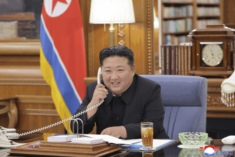 In this photo provided by the North Korean government, its leader Kim Jong Un speaks with Russian President Vladimir Putin on the phone at an undisclosed location in North Korea, Aug. 12. Independent journalists were not given access to cover the event depicted in this image and its content cannot be independently verified.