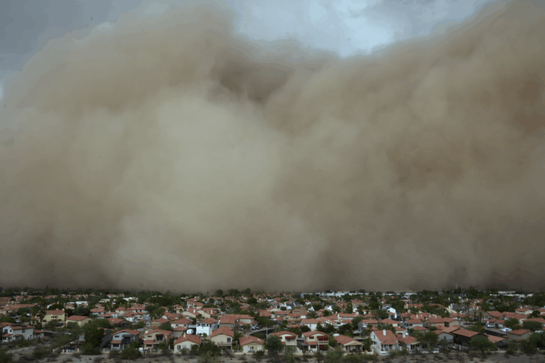 A giant dust storm approaches the Phoenix metro area as a monsoon storm pushes the dust into the air on Aug. 25 in Phoenix, Az.