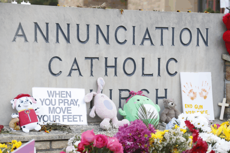 A make-shift memorial is set up at Annunciation Catholic Church after the Wednesday's shooting at the school, Friday, Aug. 29, 2025, in Minneapolis. (AP Photo/Bruce Kluckhohn)
