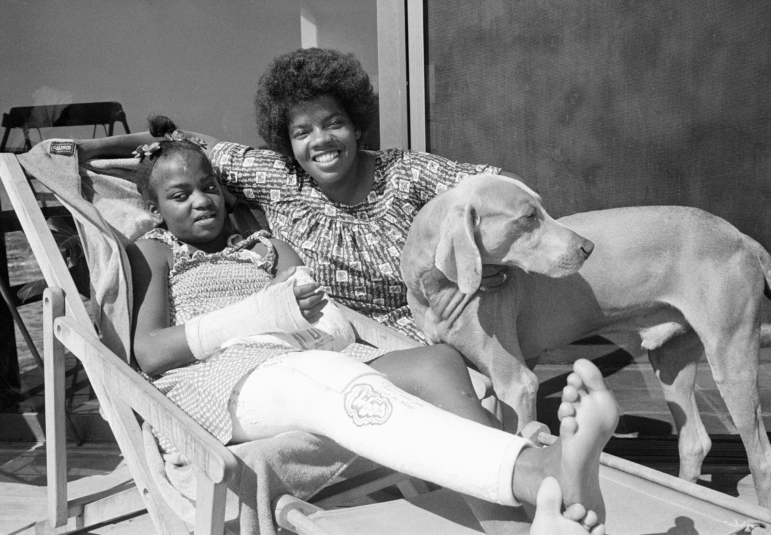 Danielle Spencer, left, and mother Cheryl Pelt rest at home in Malibu, Calif. after Spencer's release from Santa Monica Hospital on Friday, Sept. 16, 1977.