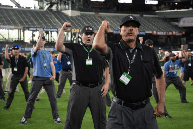 Attendees at the July MLB Umpire Camp in Milwaukee began their day practicing the proper technique for an umpire's most common calls: strike, ball, safe and out.