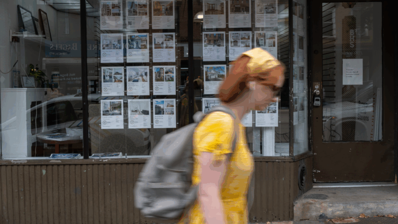 Ads for rental apartments are posted on the window of a real estate agent's office in Brooklyn, New York, during the summer of 2022.