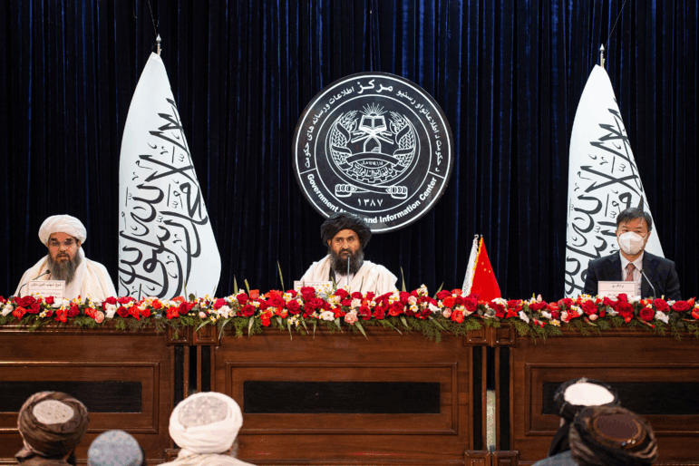 The Taliban's acting minister of mines and petroleum Shahabuddin Dilawar (left), acting first deputy prime minister Abdul Ghani Baradar (center) and China's envoy to Afghanistan Wang Yu attend a press conference to announce an oil extraction contract with a Chinese company, in Kabul on Jan. 5, 2023.