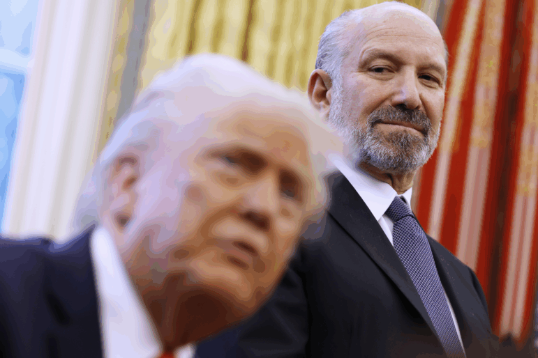 Howard Lutnick, who now oversees the Census Bureau as the commerce secretary, stands behind President Trump in the Oval Office of the White House in Washington, D.C., in February before his confirmation to Trump’s cabinet.