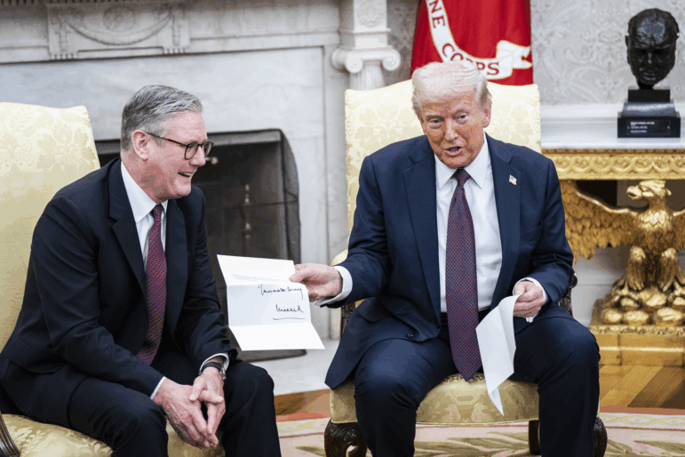 President Trump is given a letter from King Charles III, by British Prime Minister Keir Starmer in the Oval Office at the White House on Feb 27