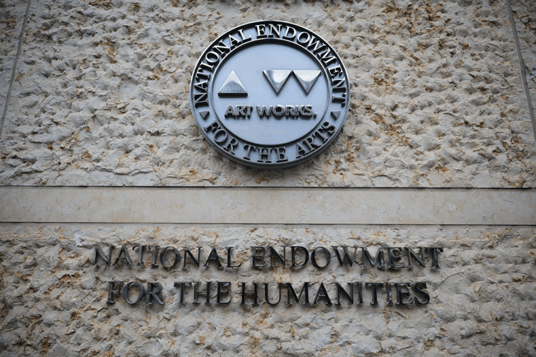 Rain falls on the National Endowment for the Humanities building (NEH) on April 11, 2025 in Washington, DC. The NEH and the Department of Government Efficiency (DOGE) laid off staff at the agency and cancelled grants across the country.
