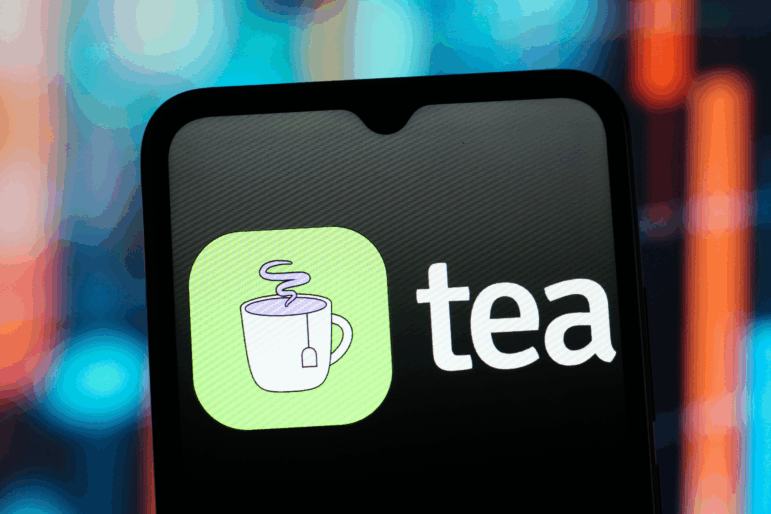 In this photo illustration, the Tea app logo is seen displayed on a smartphone screen. The dating advice app suffered a major data leak last month.