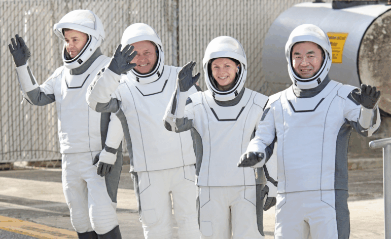Crew-11 mission astronauts wave as they head to the launch pad at the Kennedy Space Center in Cape Canaveral, Fla. on Friday. From Left to right, Roscosmos cosmonaut Oleg Platonov, NASA astronaut Mike Fincke, NASA astronaut and mission commander Zena Cardman and JAXA astronaut Kimiya Yui. The crew will live and work aboard the International Space Station for at least six months.