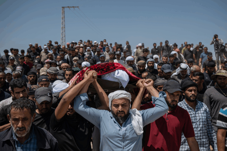 Family and friends of Awdah Hathaleen carry his body to the cemetery during his funeral on Aug. 7, 2025 in Umm al-Kheir, West Bank. The 31-year-old Palestinian activist and father of three was killed on July 28 when Israeli settler Yinon Levi allegedly opened fire during a confrontation in the Bedouin village of Umm al-Kheir (or Umm al-Khair), in the Masafer Yatta region of the occupied West Bank.