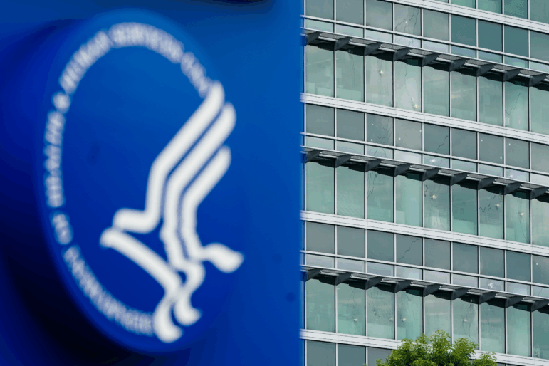 Bullet holes are seen in windows at the Centers For Disease Control and Prevention (CDC) Global Headquarters following an August 8 shooting that killed a DeKalb County Police Department officer.