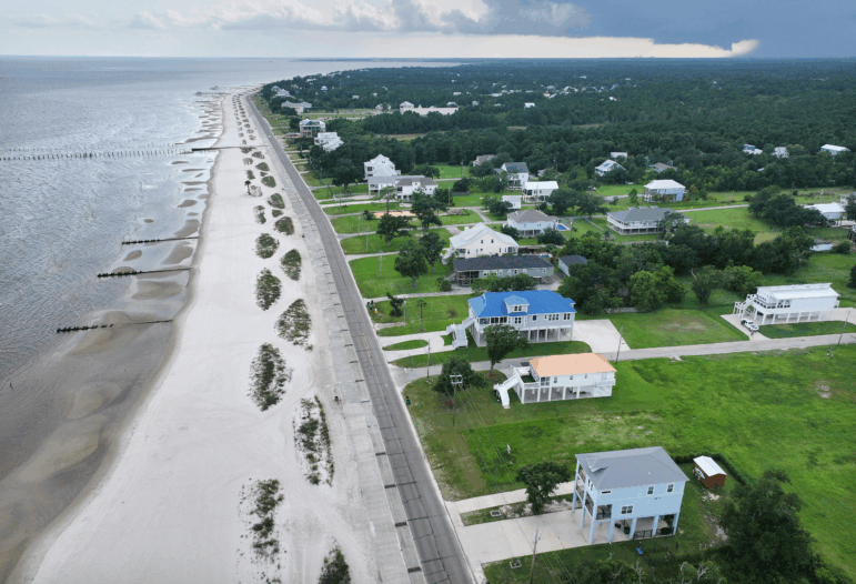 An aerial view of rebuilt elevated homes earlier this month along Waveland Beach in Mississippi, an area hard-hit by Hurricane Katrina 20 years ago. The catastrophic storm sent an approximately 30-foot-high storm surge into Waveland and destroyed or damaged nearly every home in the town. Nearly 1,400 people died across the Gulf Coast, and it remains the costliest storm in U.S. history at around $200 billion in today’s dollars.