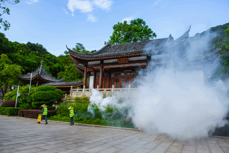A worker uses a sprayer to eradicate mosquitos at a park in order to prevent the spread of mosquito-borne disease Chikungunya on August 7, 2025 in Shenzhen, Guangdong Province of China.