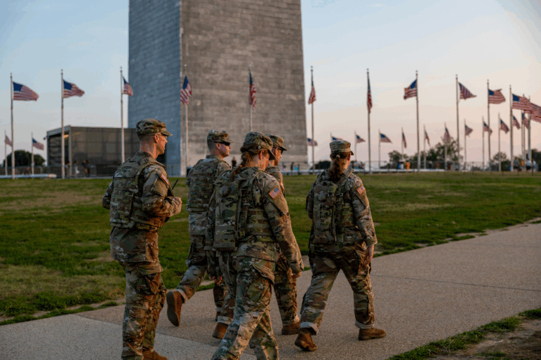Members of the National Guard patrol near the Washington Monument on Saturday.