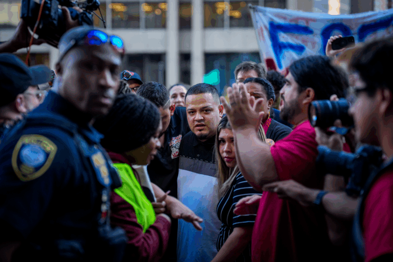 Kilmar Abrego Garcia (C) and his wife Jennifer Vasquez Sura (Center Right) enter a U.S. Immigration and Customs Enforcement (ICE) field office on Monday in Baltimore, Maryland. The U.S. Government is threatening to deport Garcia, a Maryland construction worker from El Salvador, to Uganda after he rejected a plea deal to be charged with Human Smuggling and deported to Costa Rica.