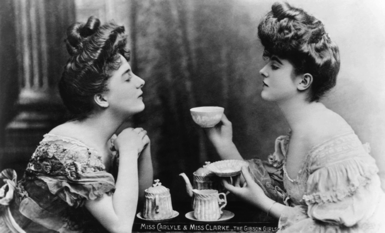 "Gibson Girls" Miss Carlyle and Miss Clarke take tea. Gibson Girls were a tall, slim-waisted type of women characterized by the drawings of American society illustrator Charles Gibson circa 1905.