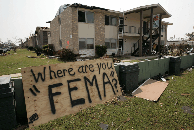 A sign sits in front of an apartment complex on September 4, 2005 in Biloxi, Ms., which was hit hard by the storm.