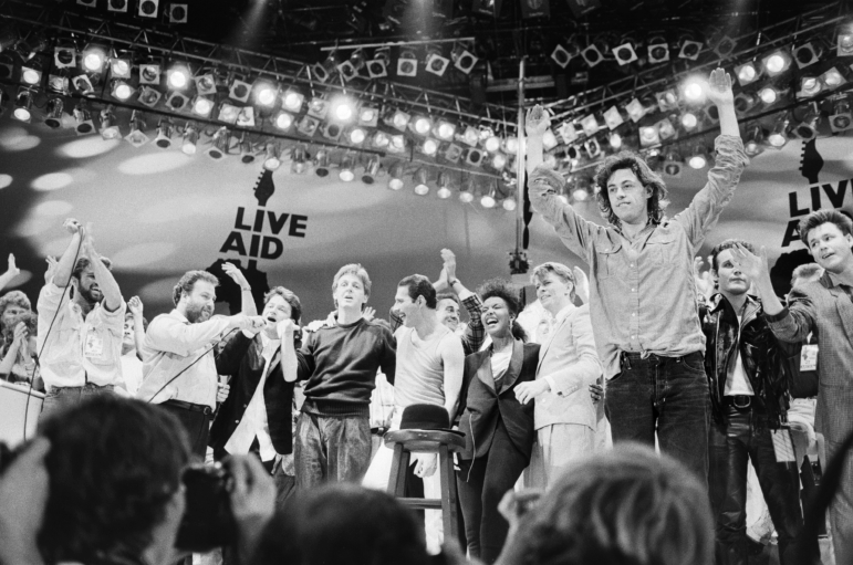 Live Aid dual venue benefit concert held on 13th July 1985 at Wembley Stadium in London, England, the concerts were organised as a follow up to the Band Aid single 'Do They Know Its Christmas?', the brainchild of Bob Geldof and Midge Ure, to raise money for victims of the famine in Ethiopia; picture shows the performers on stage for the grand finale of the concert at Wembley.