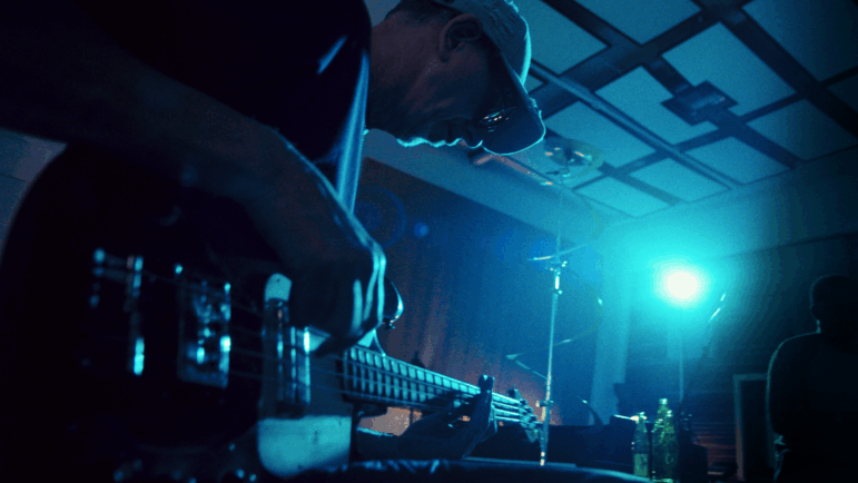 Pino Palladino plays bass in the studio.